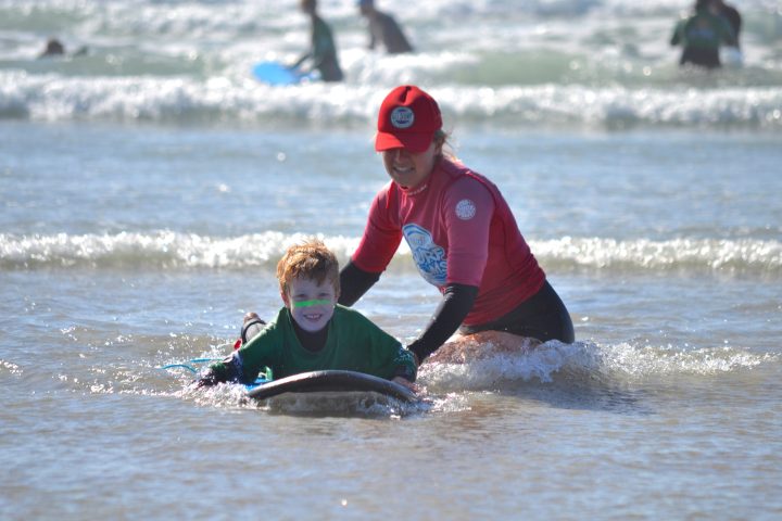 a man riding a wave on a surfboard in the water