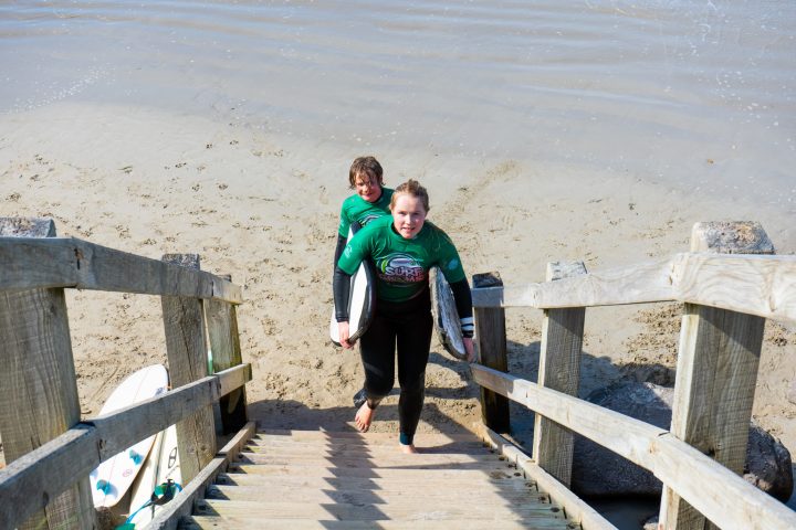 a young boy standing on a beach
