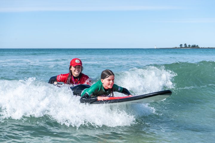 a man riding a wave on a surfboard in the ocean