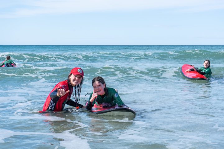 a man riding a surfboard in the water